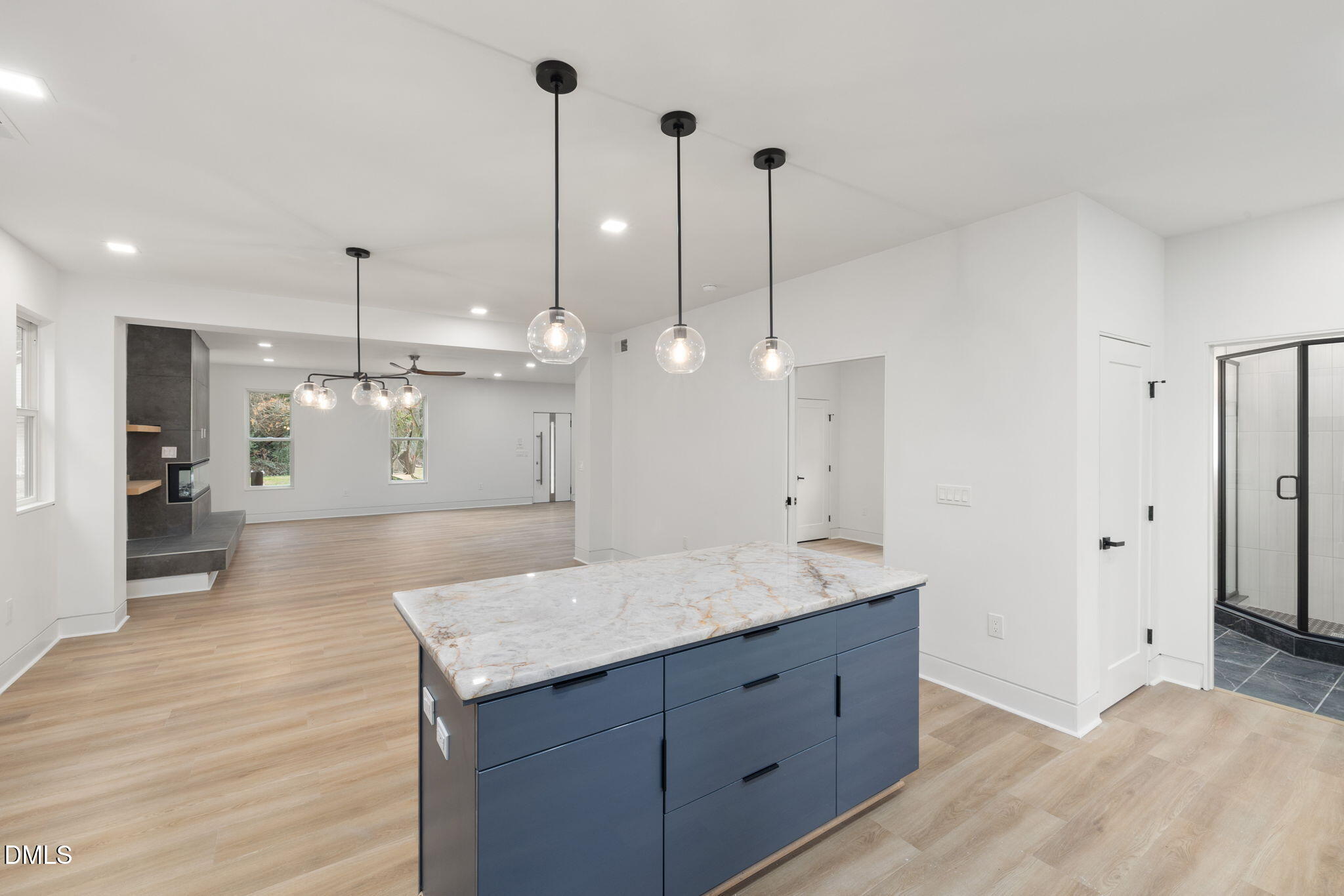309 Bragg Street Raleigh, NC 27601 - Photo 9 of 55 a spacious bathroom with a granite countertop sink a mirror and a shower