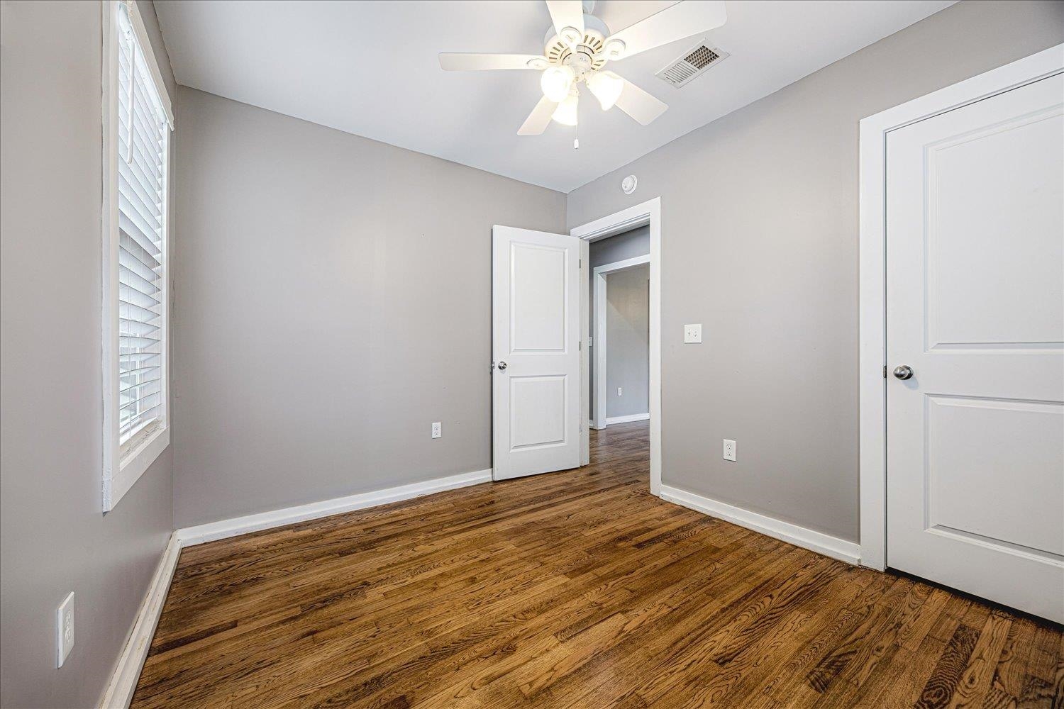 708 Loeb Street Memphis, TN 38111 - Photo 14 of 19 wooden floor in an empty room with a window