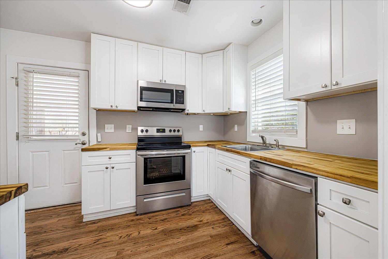 708 Loeb Street Memphis, TN 38111 - Photo 8 of 19 a kitchen with stainless steel appliances granite countertop a stove a sink and a microwave