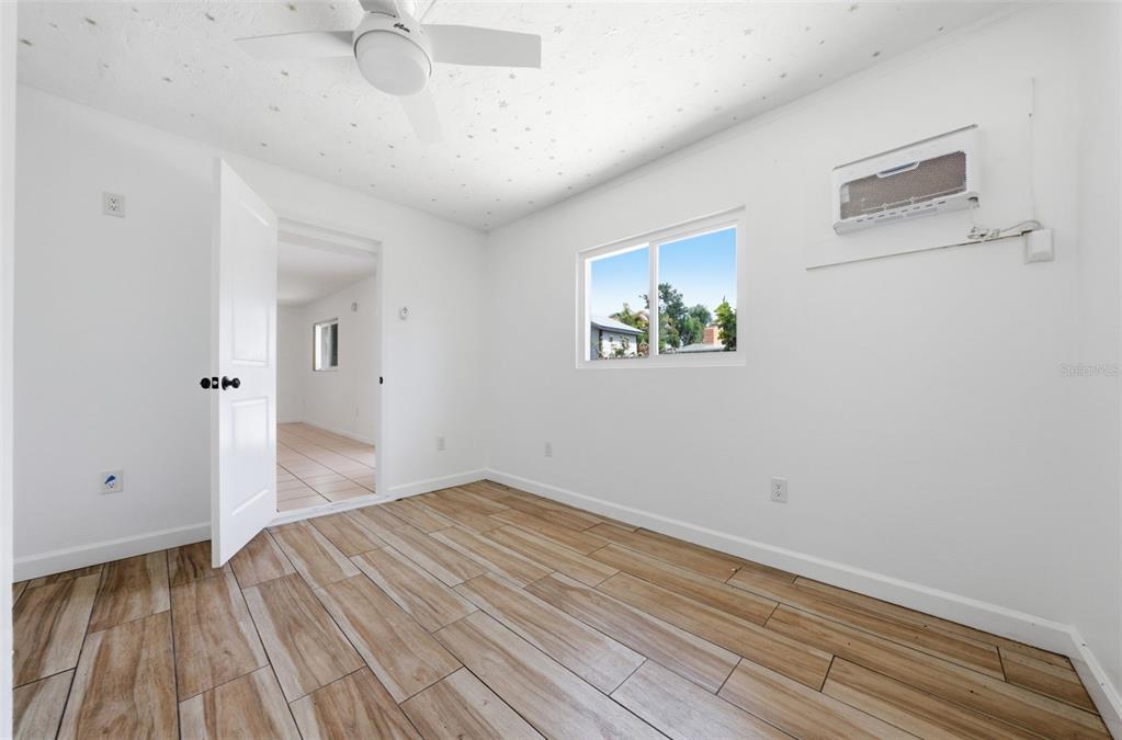 4536 Webber Street Sarasota, FL 34232 - Photo 17 of 45 a view of empty room with wooden floor