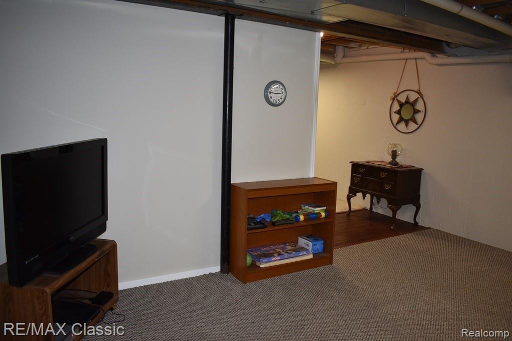 365 East Dawson Road Milford, MI 48381 - Photo 40 of 57 basement exercise area tv and landing.jpg