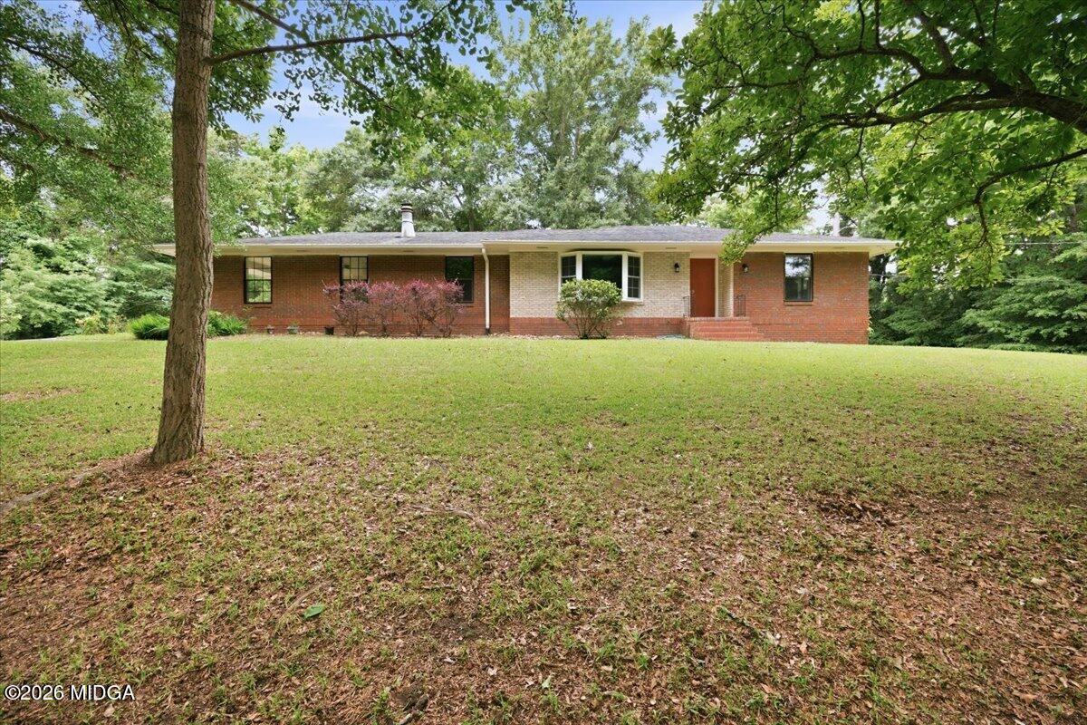 4506 Rivoli Drive Macon, GA 31210 - Photo 1 of 35 a front view of a house with garden