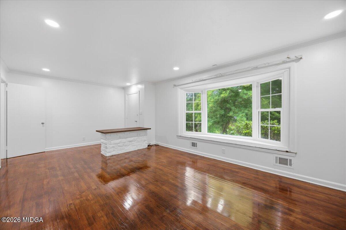 4506 Rivoli Drive Macon, GA 31210 - Photo 12 of 35 a view of empty room with wooden floor and fan