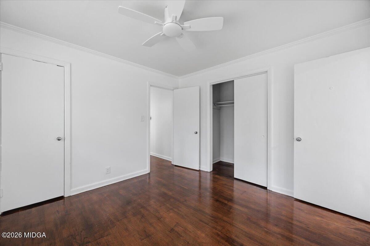 4506 Rivoli Drive Macon, GA 31210 - Photo 21 of 35 an empty room with wooden floor and windows