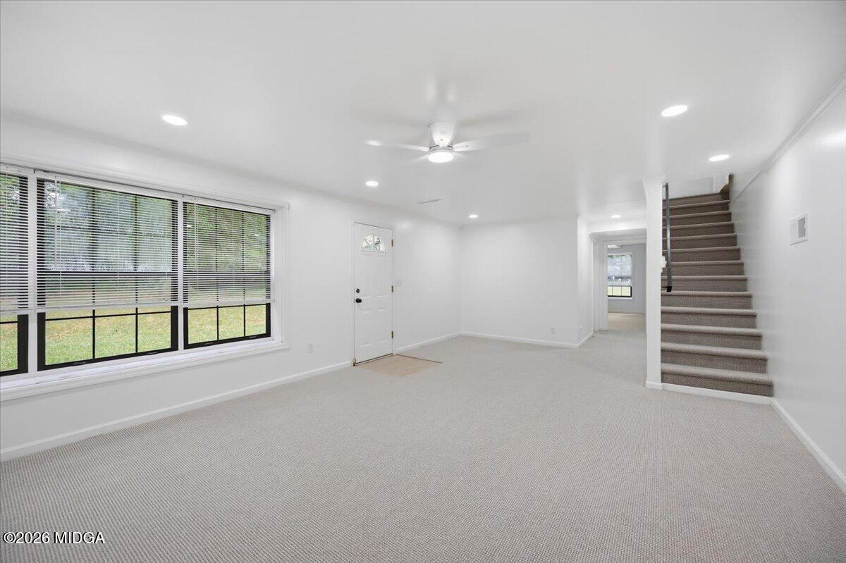 4506 Rivoli Drive Macon, GA 31210 - Photo 23 of 35 an empty room with windows and pillars in it