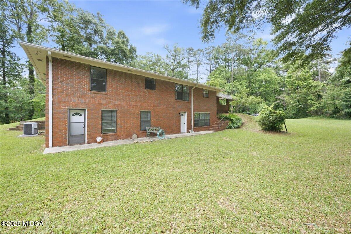 4506 Rivoli Drive Macon, GA 31210 - Photo 34 of 35 a backyard of a house with table and chairs