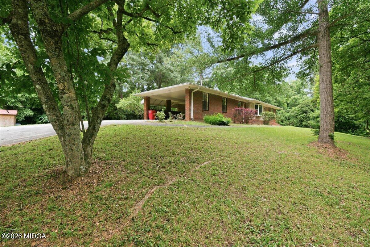 4506 Rivoli Drive Macon, GA 31210 - Photo 4 of 35 a view of a house with a yard