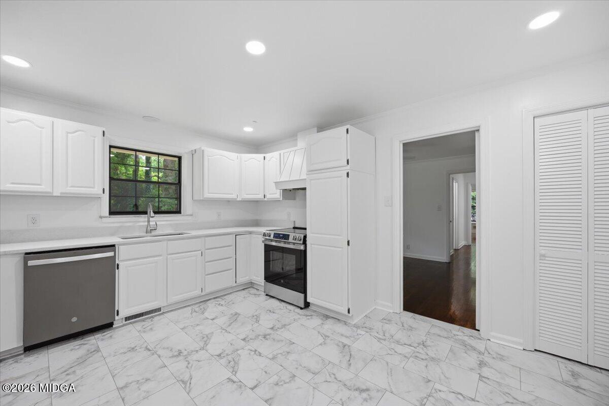 4506 Rivoli Drive Macon, GA 31210 - Photo 5 of 35 a kitchen with stainless steel appliances granite countertop a refrigerator and a sink