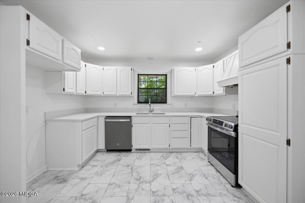 4506 Rivoli Drive Macon, GA 31210 - Photo 6 of 35 a kitchen with a sink stove and refrigerator