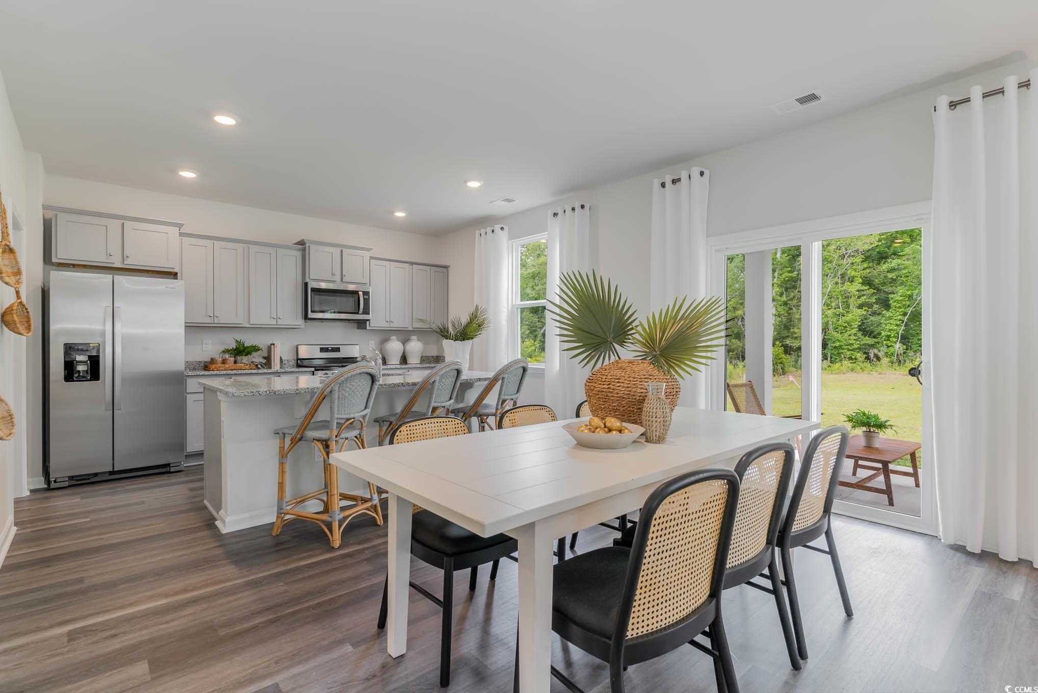 137 Homestead Way Myrtle Beach, SC 29588 - Photo 11 of 27 Dining room featuring dark wood-style flooring and recessed lighting