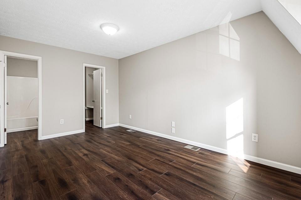 2037 Laboon Circle Atlanta, GA 30349 - Photo 13 of 18 a view of an empty room with wooden floor