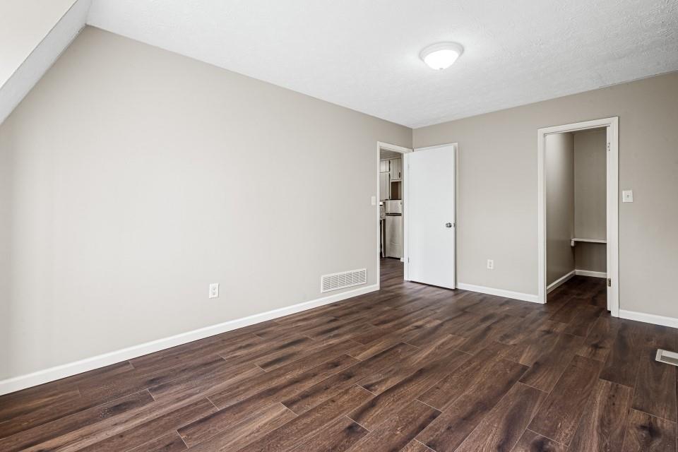 2037 Laboon Circle Atlanta, GA 30349 - Photo 14 of 18 a view of an empty room with wooden floor