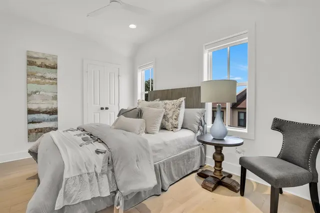 a balcony view with a potted plant and outdoor seating