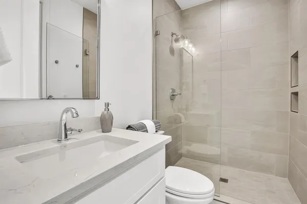 a bed room with a bed and a chair