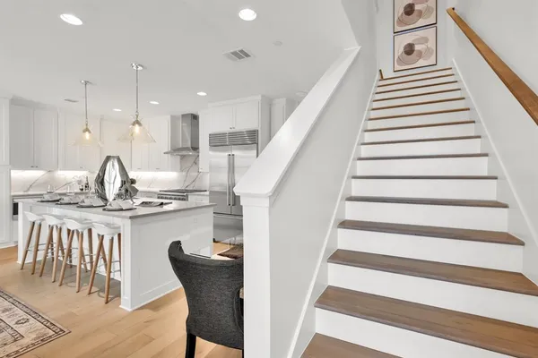 a bathroom with a sink toilet vanity and shower