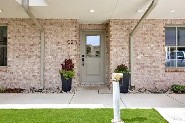 a front view of a house with yard