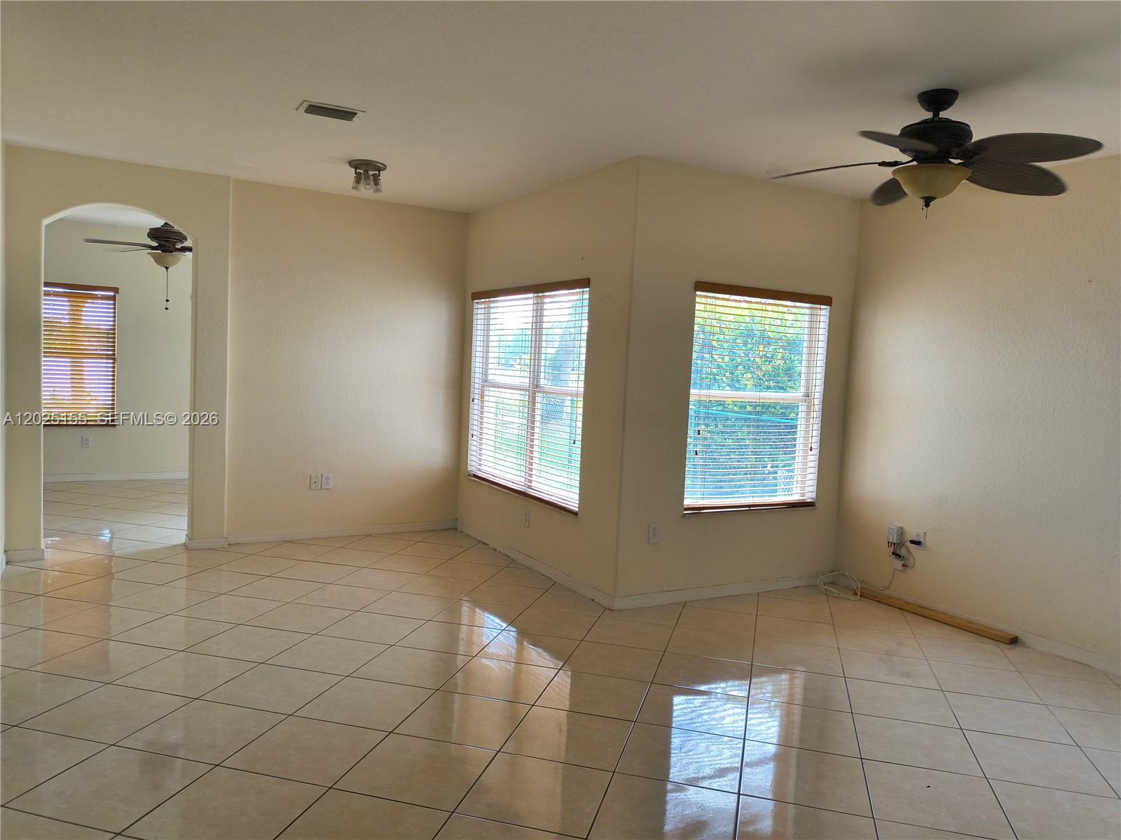 1645 Southeast 20th Road, Unit 1645 Homestead, FL 33035 - Photo 6 of 20 a view of an empty room and window