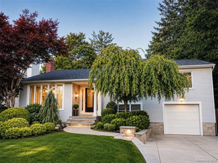 5 Eaton Road Syosset, NY 11791 - Photo 1 of 19 a front view of a house with a yard and potted plants