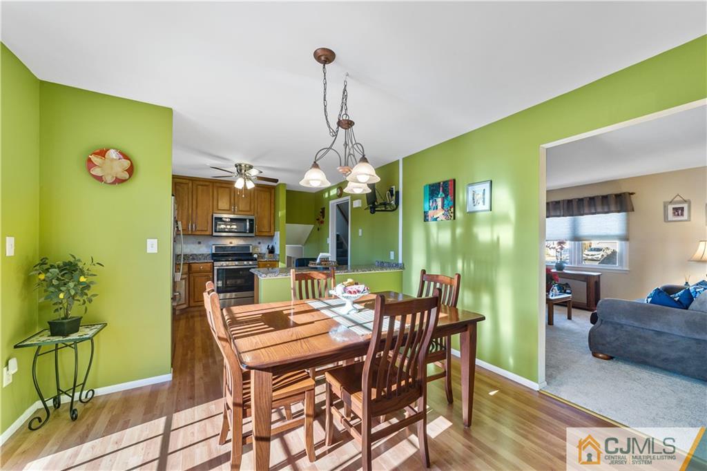 6 Albemarle Road East Brunswick, NJ 08816 - Photo 11 of 30 a dining room with furniture and chandelier