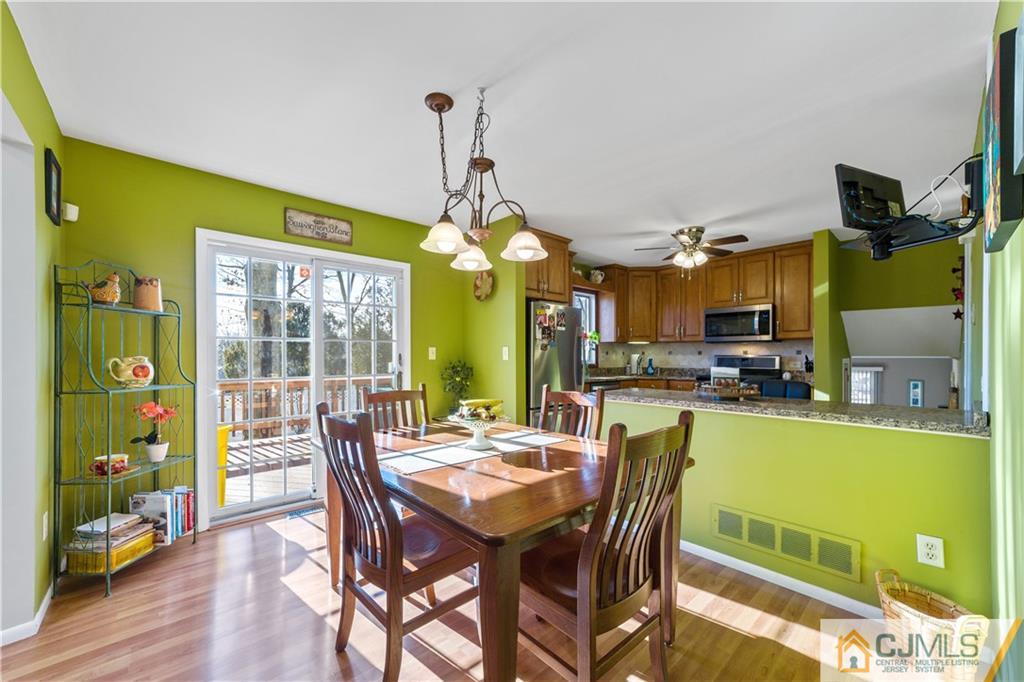 6 Albemarle Road East Brunswick, NJ 08816 - Photo 13 of 30 a view of a dining room with furniture window and wooden floor