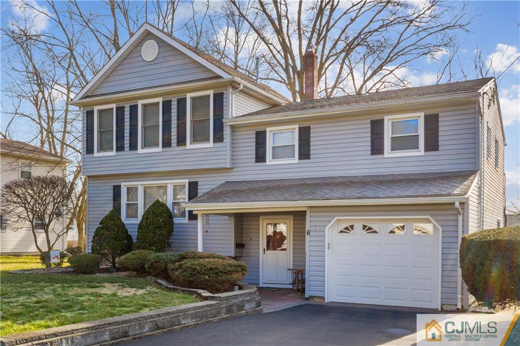 6 Albemarle Road East Brunswick, NJ 08816 - Photo 2 of 30 a front view of a house with garden