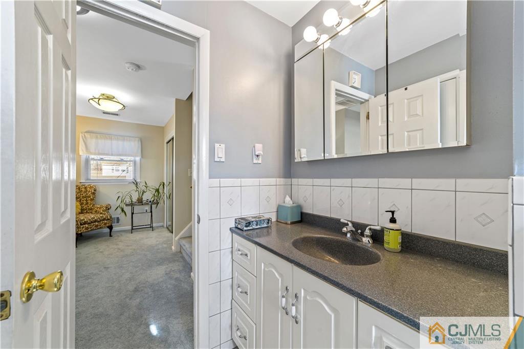 6 Albemarle Road East Brunswick, NJ 08816 - Photo 21 of 30 a kitchen with sink cabinets and counter space