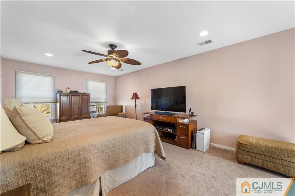 6 Albemarle Road East Brunswick, NJ 08816 - Photo 23 of 30 a bedroom with bed and a flat screen tv