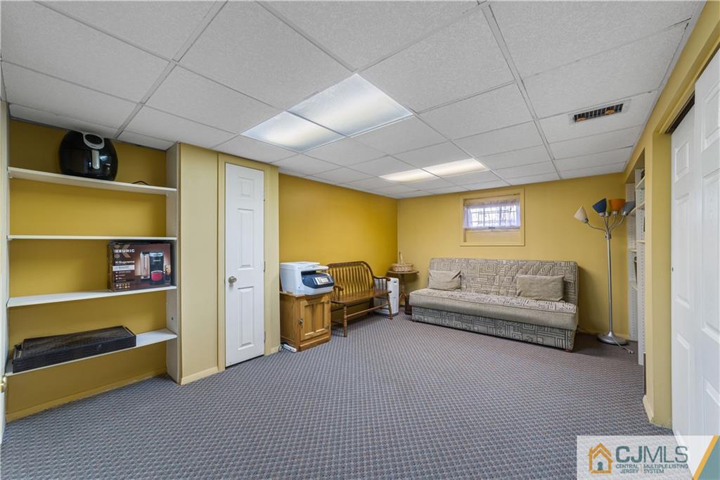 6 Albemarle Road East Brunswick, NJ 08816 - Photo 26 of 30 a living room with furniture and a window