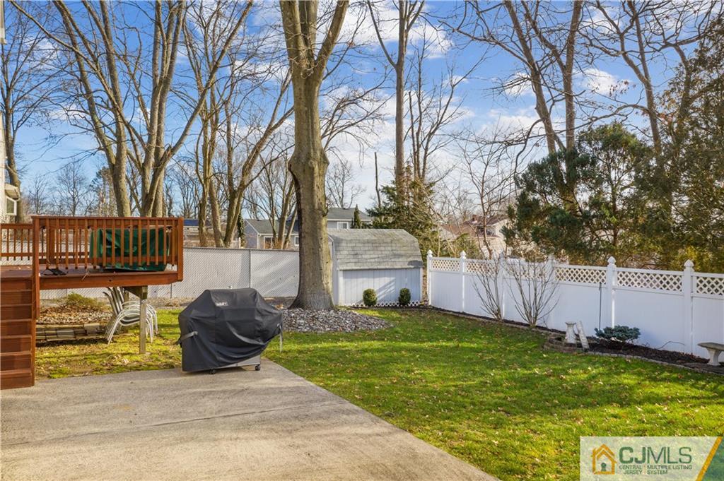 6 Albemarle Road East Brunswick, NJ 08816 - Photo 30 of 30 a view of a garden with wooden fence