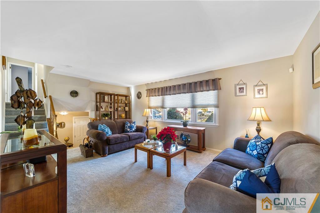 6 Albemarle Road East Brunswick, NJ 08816 - Photo 7 of 30 a living room with furniture and a flat screen tv