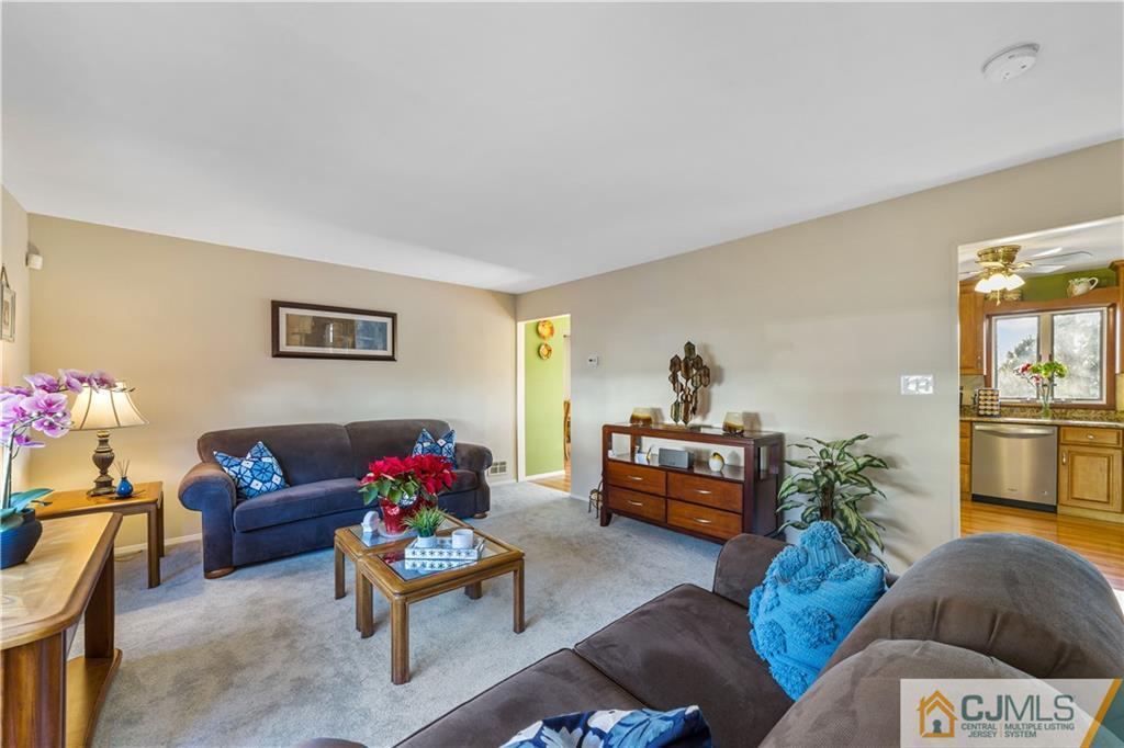 6 Albemarle Road East Brunswick, NJ 08816 - Photo 8 of 30 a living room with furniture and a couch