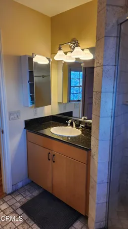 a bathroom with a shower and toilet