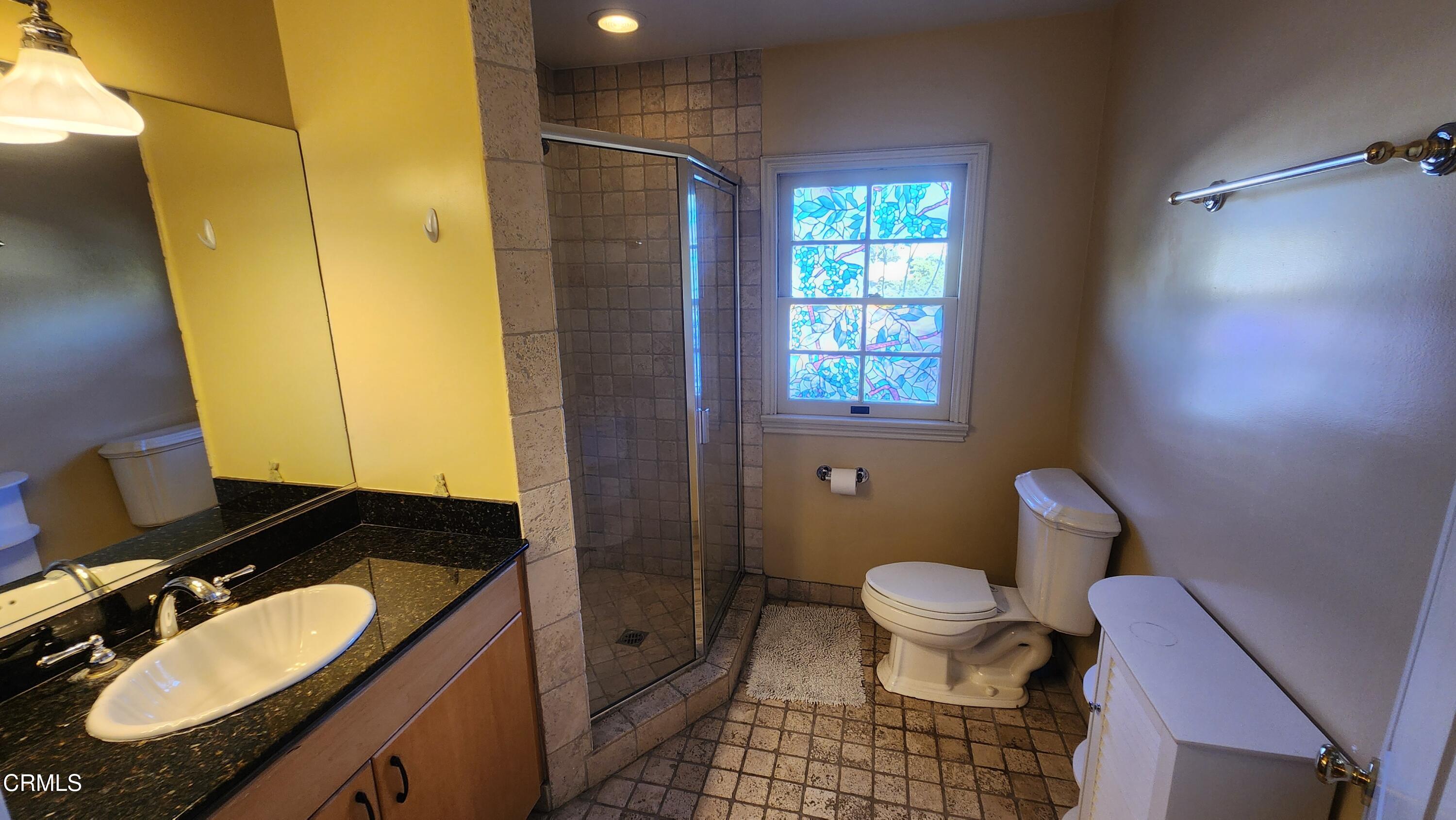 1772 Corson Street Pasadena, CA 91106 - Photo 13 of 25 a bathroom with a granite countertop sink toilet and shower