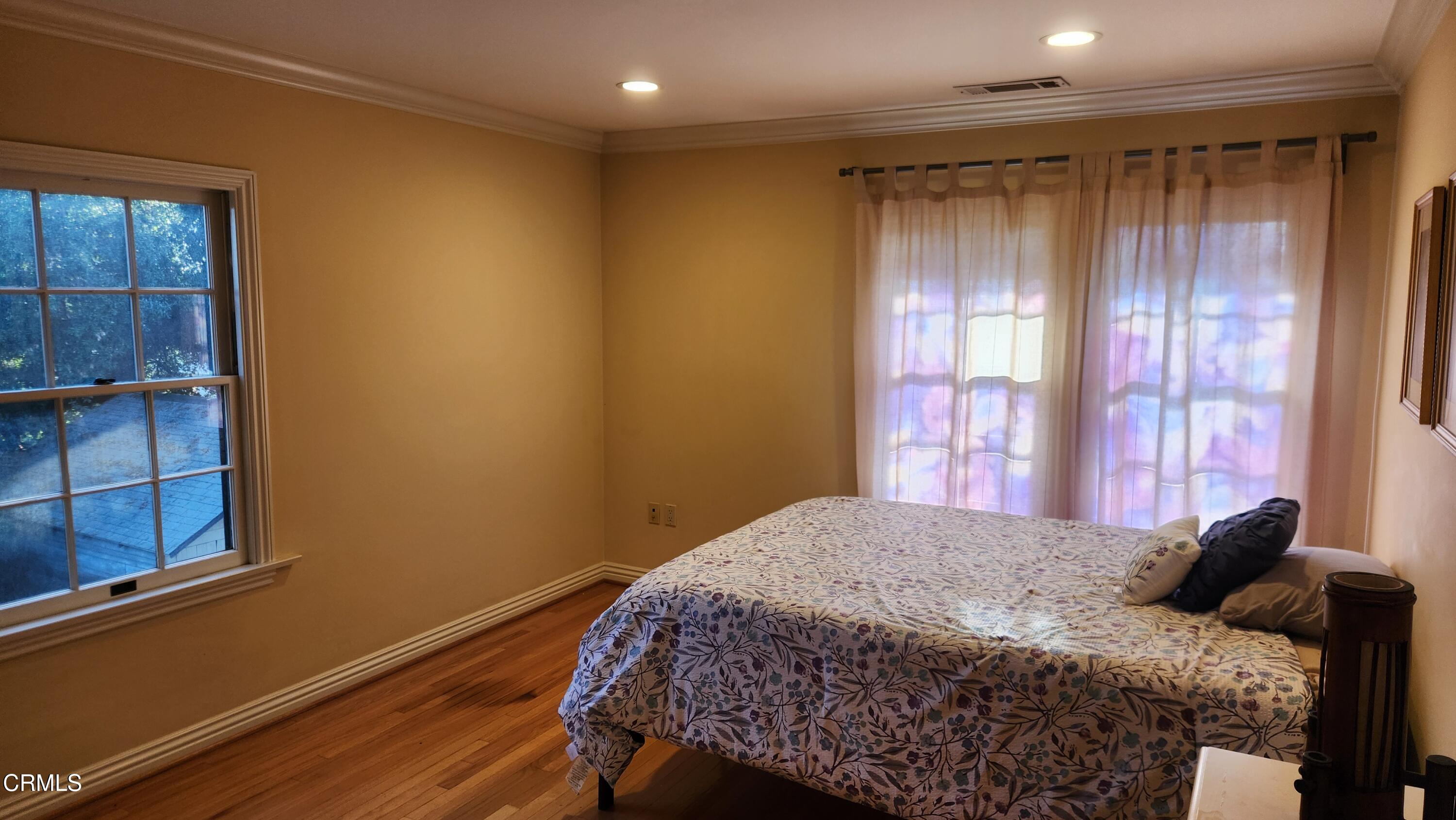 1772 Corson Street Pasadena, CA 91106 - Photo 16 of 25 a bedroom with a bed and a window
