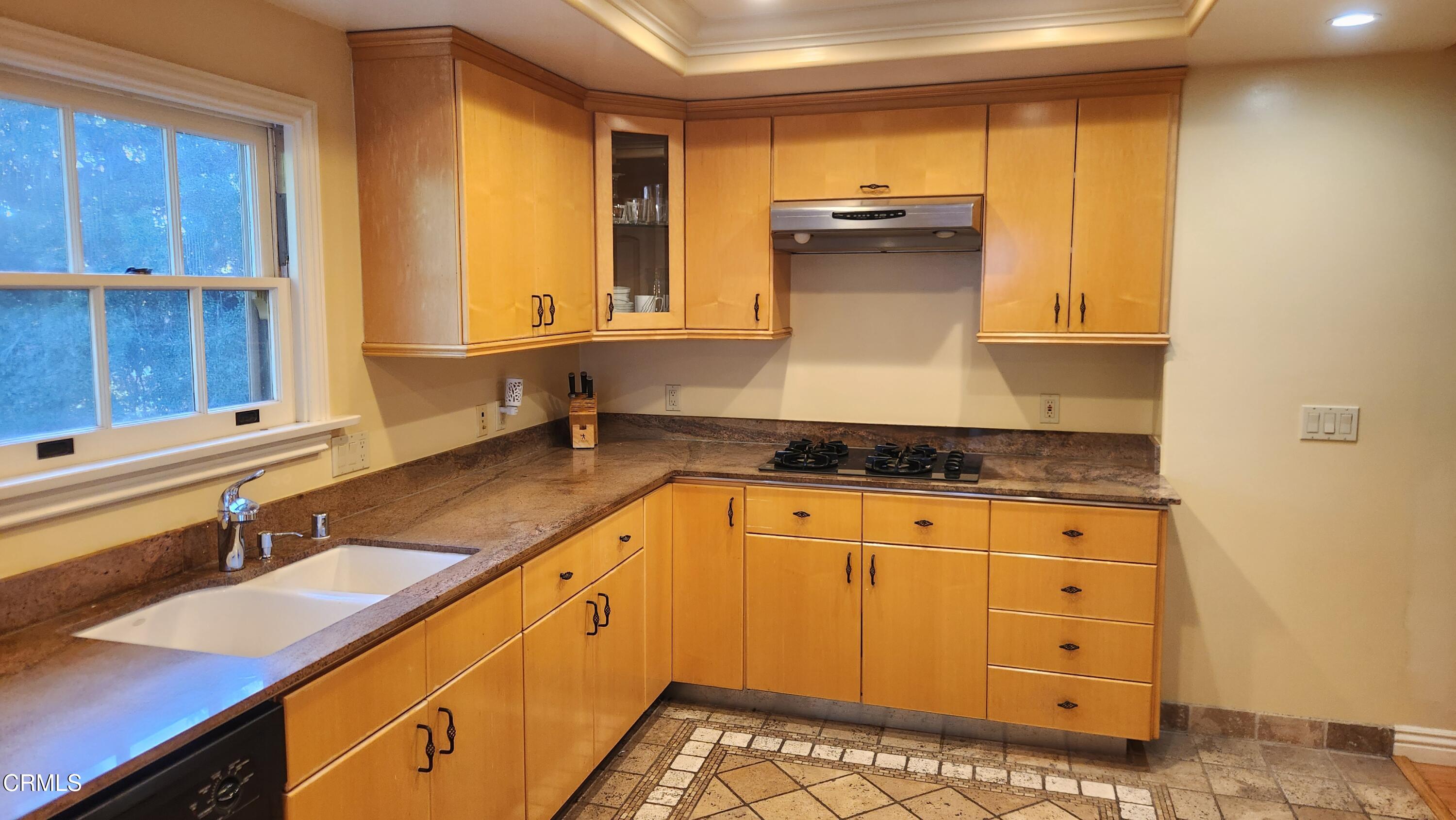 1772 Corson Street Pasadena, CA 91106 - Photo 6 of 25 a kitchen with granite countertop a sink a stove and cabinets
