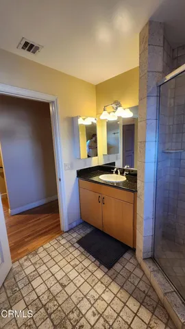 a kitchen with stainless steel appliances kitchen island granite countertop a sink and cabinets