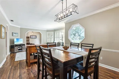 a kitchen with stainless steel appliances granite countertop a sink a stove and a microwave