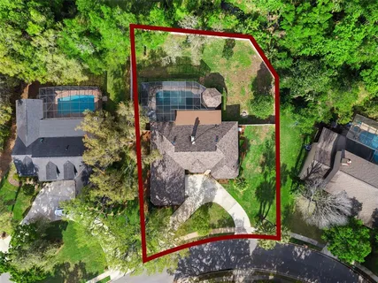 an aerial view of a house with a garden view