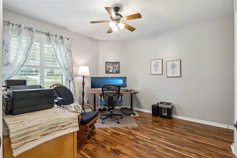a view of a dining room with furniture wooden floor and a chandelier
