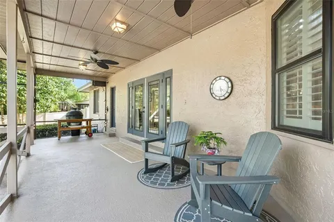 an aerial view of a house with a yard basket ball court and outdoor seating
