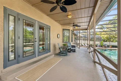 an aerial view of a house with a yard basket ball court