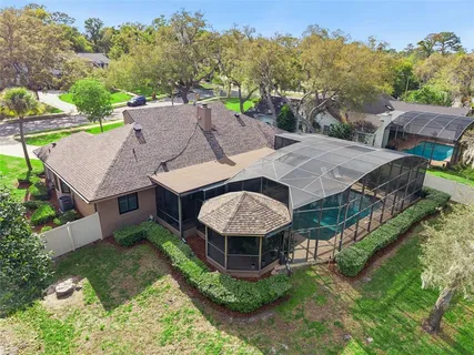 an aerial view of a house with yard