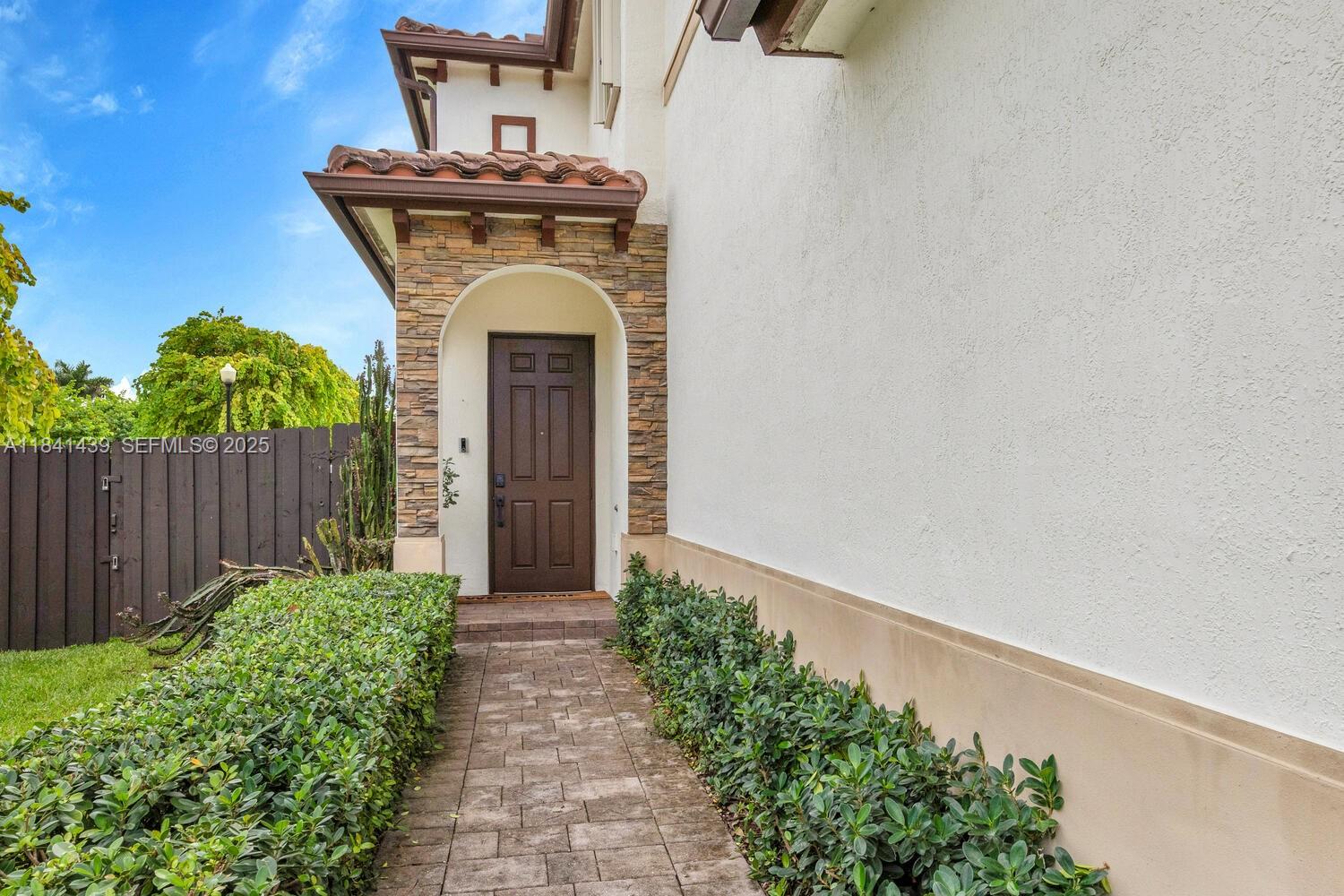 455 Southeast 34th Terrace Homestead, FL 33033 - Photo 2 of 40 Nicely landscaped and paved walkway welcomes you home!