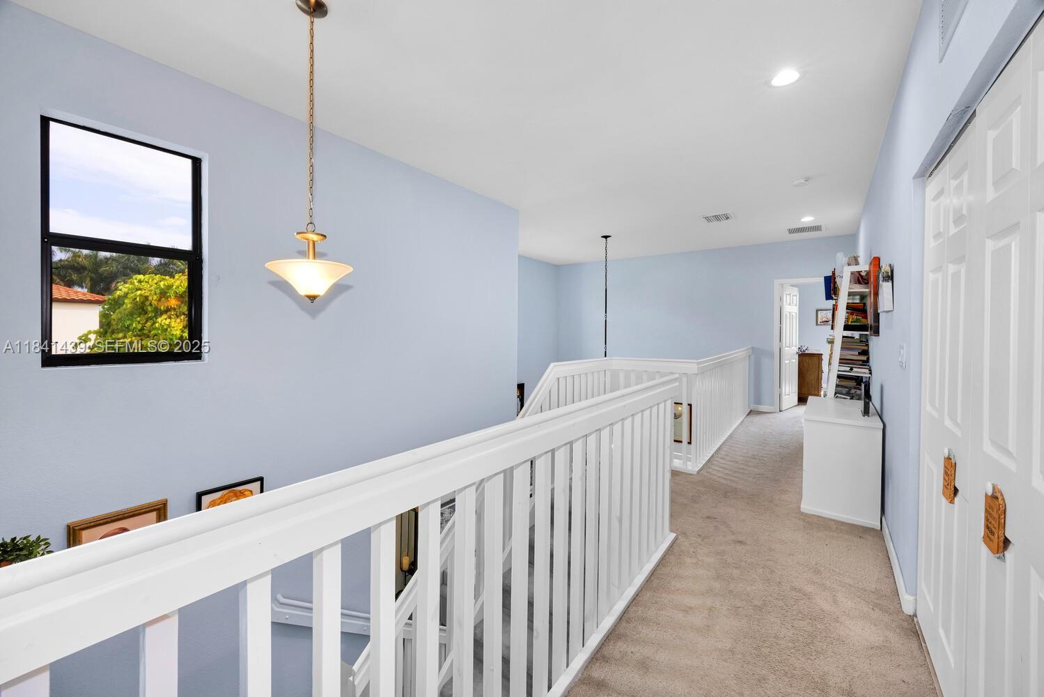 455 Southeast 34th Terrace Homestead, FL 33033 - Photo 22 of 40 Upstairs area with spacious bedrooms, all with built-in custom closets.