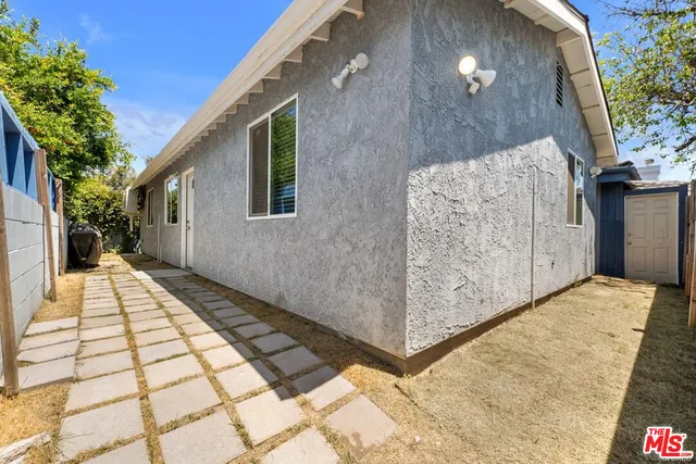 a view of backyard with a balcony