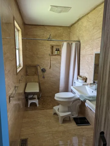 a bathroom with a toilet and a sink