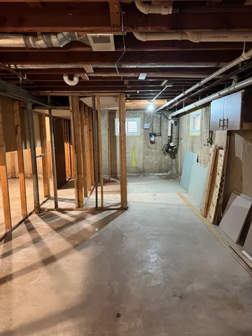 a view of an empty room with wooden walls