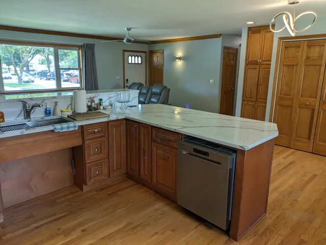 a view of a sink a mirror and a cabinets