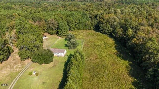 a view of a small yard with wooden fence