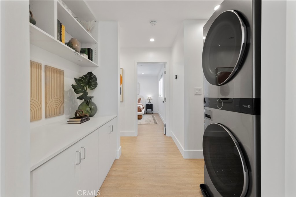 5248 Segals Way Sherman Oaks, CA 91411 - Photo 16 of 37 a view of a hallway with washer and dryer